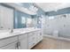 Bathroom with double vanity and shower at 1407 Fairview Cir, Reunion, FL 34747