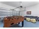 Finished garage converted into a game room with foosball table and seating at 1407 Fairview Cir, Reunion, FL 34747