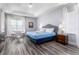 Main bedroom with sitting area and king bed at 1407 Fairview Cir, Reunion, FL 34747