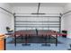 Garage game room features ping pong table for entertainment at 1407 Fairview Cir, Reunion, FL 34747