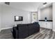 Bright bonus room with comfy seating and access to backyard at 1407 Fairview Cir, Reunion, FL 34747