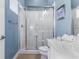 Modern bathroom featuring a walk-in shower and updated fixtures at 1407 Fairview Cir, Reunion, FL 34747