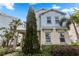 Two-story home with light blue siding and stone accents at 1407 Fairview Cir, Reunion, FL 34747