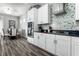 Modern kitchen with white cabinets and granite at 1407 Fairview Cir, Reunion, FL 34747