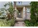 Inviting entryway with stone accents and lush landscaping at 1407 Fairview Cir, Reunion, FL 34747