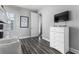 Second bedroom with a dresser and TV at 1407 Fairview Cir, Reunion, FL 34747