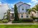 Two-story home with light blue siding and stone accents at 1407 Fairview Cir, Reunion, FL 34747