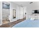 Comfortable bedroom with a TV and en-suite bathroom at 1407 Fairview Cir, Reunion, FL 34747