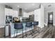 Modern kitchen with island and stainless steel appliances at 1407 Fairview Cir, Reunion, FL 34747