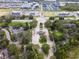 Aerial view of a gated community entrance with landscaping at 1407 Fairview Cir, Reunion, FL 34747