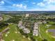 Aerial view of condos near a golf course and resort at 1407 Fairview Cir, Reunion, FL 34747