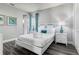 Bedroom with white bed frame and gray walls at 1407 Fairview Cir, Reunion, FL 34747