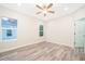 Well lit bedroom with wood-look vinyl flooring at 248 S Virginia Ave, Deland, FL 32724