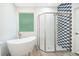 Modern bathroom with a walk-in shower and stylish tile at 250 S Virginia Ave, Deland, FL 32724