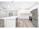 Modern kitchen with stainless steel appliances and island at 250 S Virginia Ave, Deland, FL 32724