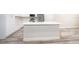White kitchen island with quartz countertop at 250 S Virginia Ave, Deland, FL 32724