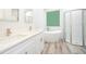 Elegant bathroom with double vanity, free-standing tub and shower at 250 S Virginia Ave, Deland, FL 32724