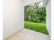 Private patio with access to a lush, green backyard at 250 S Virginia Ave, Deland, FL 32724