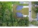Aerial view of two new homes with driveways and lush landscaping at 250 S Virginia Ave, Deland, FL 32724