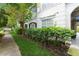 Walkway with manicured landscaping next to a residential building at 12938 Penn Station Ct # 104, Orlando, FL 32821