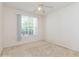 Spacious bedroom with large window and ceiling fan at 12938 Penn Station Ct # 104, Orlando, FL 32821