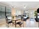 Dining area with seating for four and a view of the living room at 909 Charo Pkwy # 1021, Davenport, FL 33897