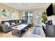 Spacious living room with sectional sofa and large TV at 909 Charo Pkwy # 1021, Davenport, FL 33897