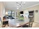 Open concept dining area with game and living room at 909 Charo Pkwy # 1021, Davenport, FL 33897