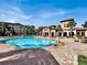 Relaxing resort-style pool with expansive sundeck at 909 Charo Pkwy # 1021, Davenport, FL 33897