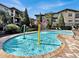 Refreshing community pool with kiddie area and plenty of lounge chairs at 909 Charo Pkwy # 1021, Davenport, FL 33897