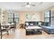 Combined dining and living area with large windows at 909 Charo Pkwy # 1021, Davenport, FL 33897