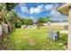 Large backyard with partial demolition and AC unit at 7414 Rose Ave, Orlando, FL 32810