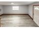 Finished basement room with laminate floors and exterior access at 7414 Rose Ave, Orlando, FL 32810