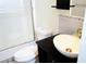Bathroom with shower, toilet, and a vessel sink on a dark vanity at 2649 Crown Ct # 2649, Kissimmee, FL 34741