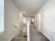 Upstairs hallway with carpet, leading to bedrooms and bathrooms at 13041 Inkwell Aly, Winter Garden, FL 34787