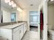 Double vanity bathroom with a toilet and shower at 13041 Inkwell Aly, Winter Garden, FL 34787