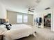 Spacious main bedroom with large bed, TV, and walk-in closet at 13041 Inkwell Aly, Winter Garden, FL 34787