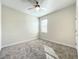 Simple bedroom with carpet and large window for natural light at 13041 Inkwell Aly, Winter Garden, FL 34787