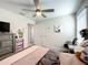 Cozy bedroom with a queen-size bed and a desk area at 13041 Inkwell Aly, Winter Garden, FL 34787