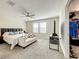 Large bedroom with a ceiling fan and walk-in closet at 13041 Inkwell Aly, Winter Garden, FL 34787