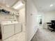Mudroom and laundry area with shelving and a washer/dryer at 13041 Inkwell Aly, Winter Garden, FL 34787