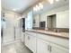 Double vanity bathroom with a walk-in shower at 13041 Inkwell Aly, Winter Garden, FL 34787