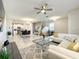 Open concept living area with a comfortable sectional sofa and modern decor at 13041 Inkwell Aly, Winter Garden, FL 34787