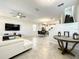 Bright and spacious living room with a view into the kitchen and dining area at 13041 Inkwell Aly, Winter Garden, FL 34787