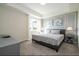 Spacious bedroom with a king-size bed and grey dresser at 3151 Paradox Cir # 101, Kissimmee, FL 34746