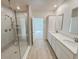 Modern bathroom with double vanity and a large shower at 2949 Sunset Dr, New Smyrna Beach, FL 32168