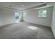 Spacious bedroom with carpet flooring and large windows at 2949 Sunset Dr, New Smyrna Beach, FL 32168