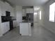 Open concept kitchen with island and stainless steel appliances at 3025 Ballad Rd, Kissimmee, FL 34746