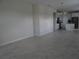Spacious living room with tile floors and neutral color palette at 3025 Ballad Rd, Kissimmee, FL 34746
