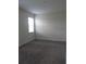 Simple bedroom with neutral walls and carpet flooring at 3025 Ballad Rd, Kissimmee, FL 34746
